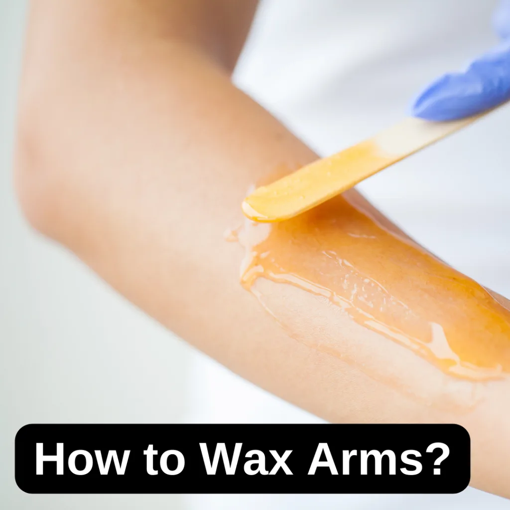 Person waxing their arms with a spatula – How to Wax Arms Guide