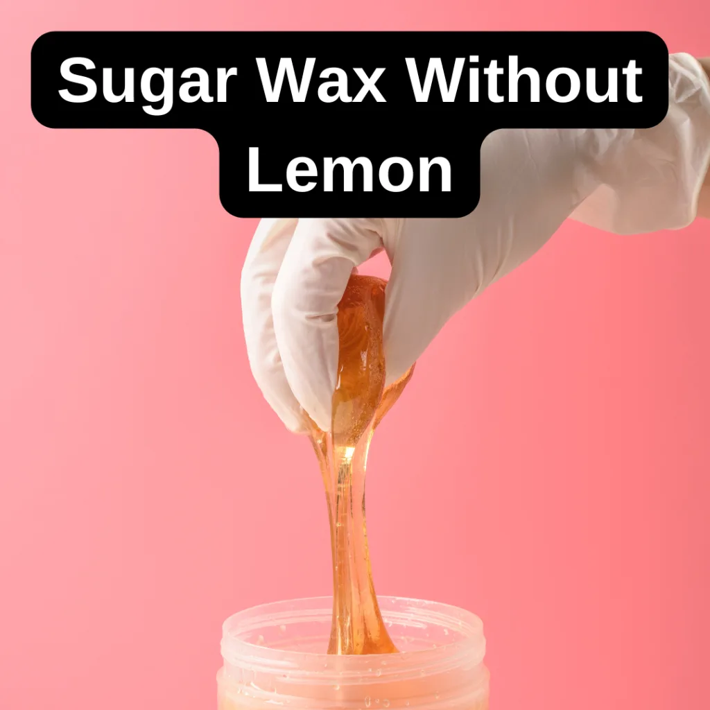 A homemade sugar wax without lemon in a glass jar with a wooden applicator.